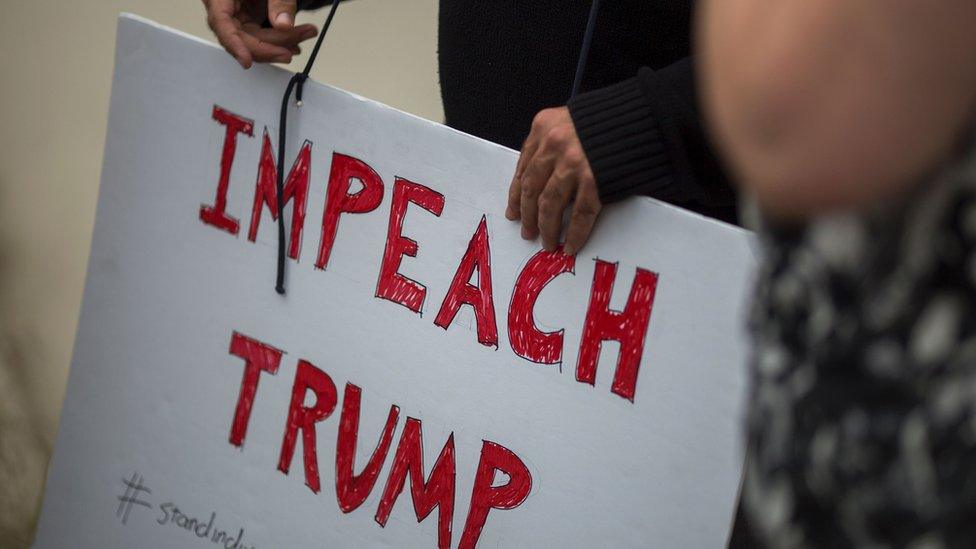 Protesters denounce the firing of FBI Director James Comey in Los Angeles, California. May 10, 2017