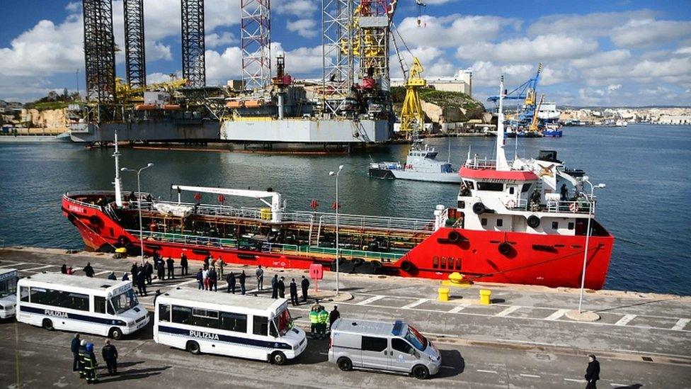 Police forces stand on the pier where Motor Tanker Elhiblu 1 that was hijacked by migrants it had rescued off Libya is docked at Boiler Wharf in Valletta's Grand Harbour on 28 March 2019