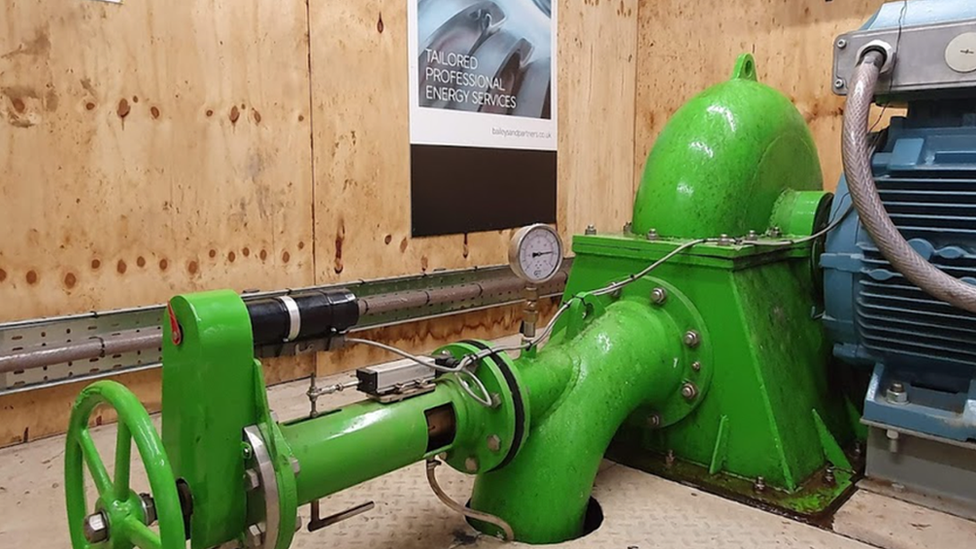 The green turbine inside the shed