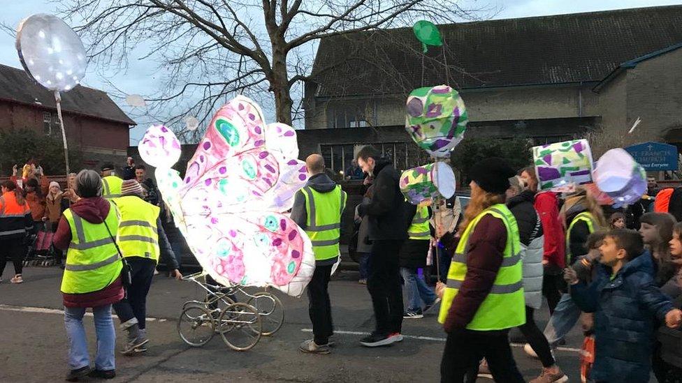 People walking and lanterns at Bedminster Winter Lantern Parade