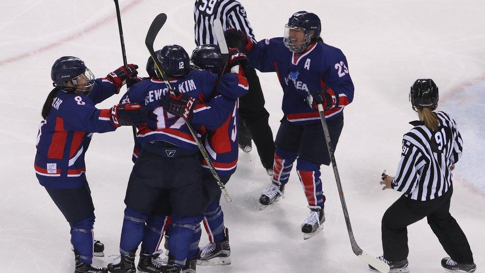 Randi Heesoo Griffin and her teammates celebrate scoring a goal against Japan.