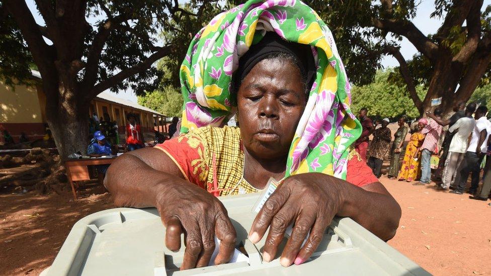 A woman casts her ballot for the presidential election at a polling station in Bole district, northern Ghana, on December 7, 2016