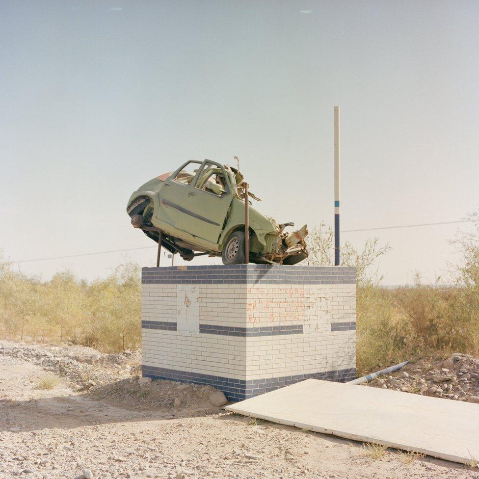 A car on a plinth to warn drivers