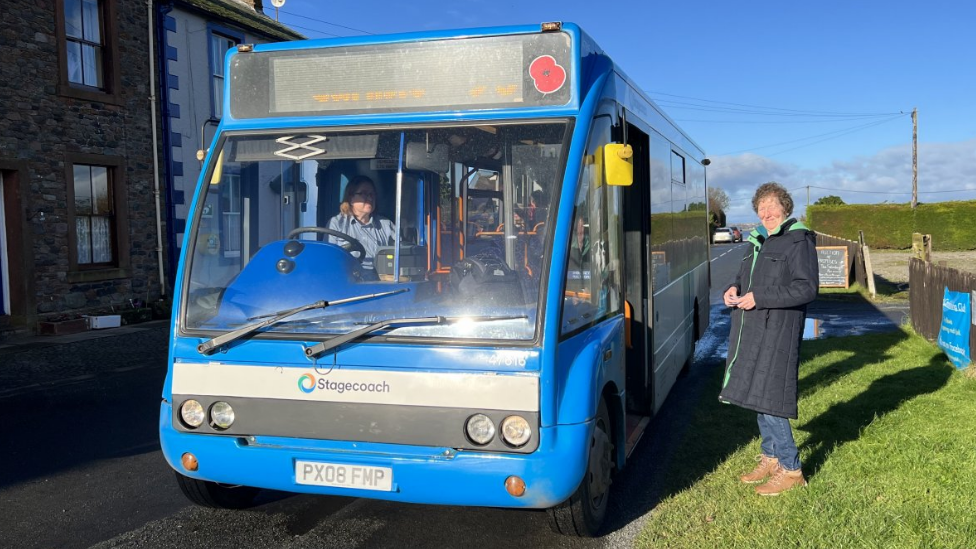 Woman waiting for Stagecoach bus