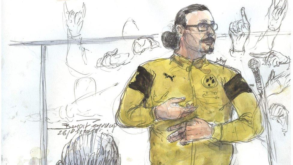 This courtroom sketch shows Jawad Bendaoud gesturing while standing in the dock