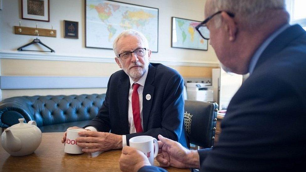 Jeremy Corbyn speaking to fellow Labour MP Jon Trickett