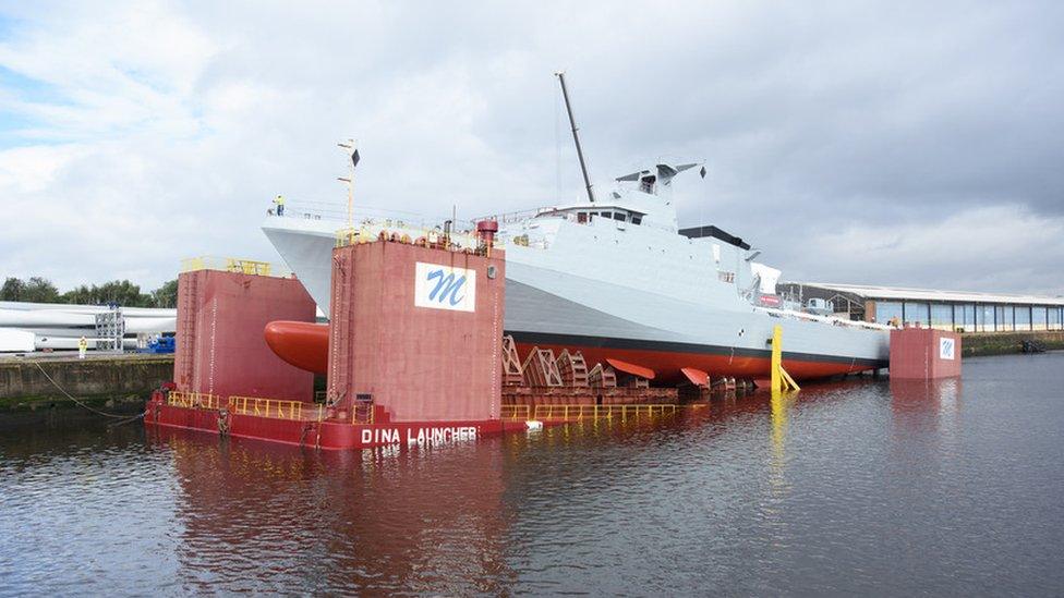 HMS Forth being lowered into the water