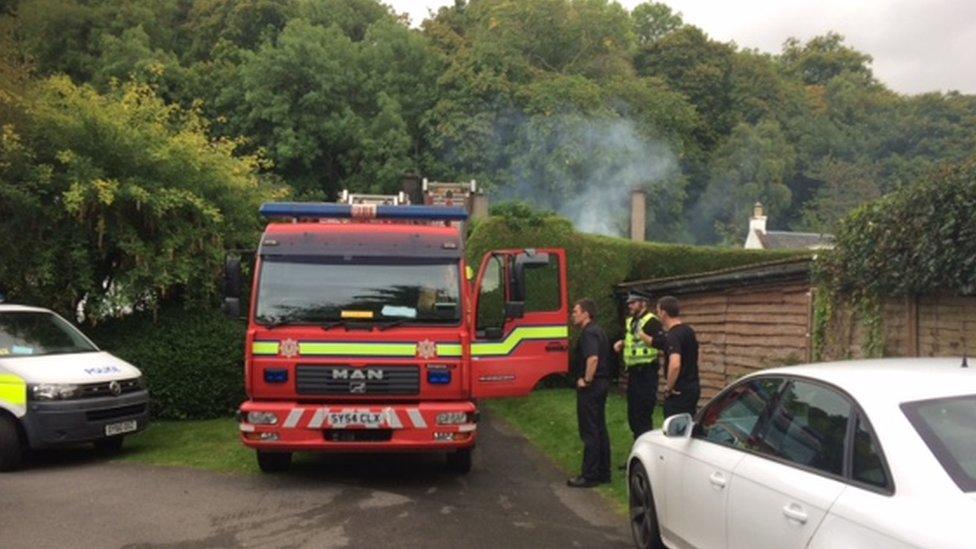 Firefighters and police at scene of the early morning blaze