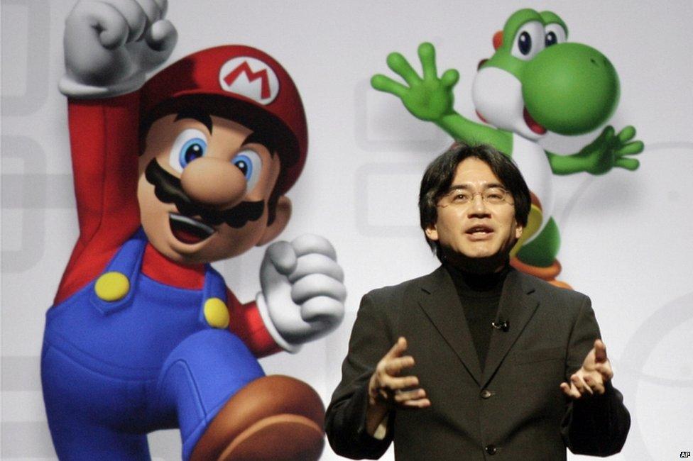 In this 15 July 2008 file photo, Satoru Iwata, President and CEO of Nintendo Co. Ltd., speaks at a news conference where Nintendo unveiled an enhancement for its Wii Remote controller and new games at the E3 Media and Business Summit in Los Angeles. Nintendo said President Iwata died Saturday, July 11, 2015, of a bile duct tumor in a Kyoto hospital, western Japan