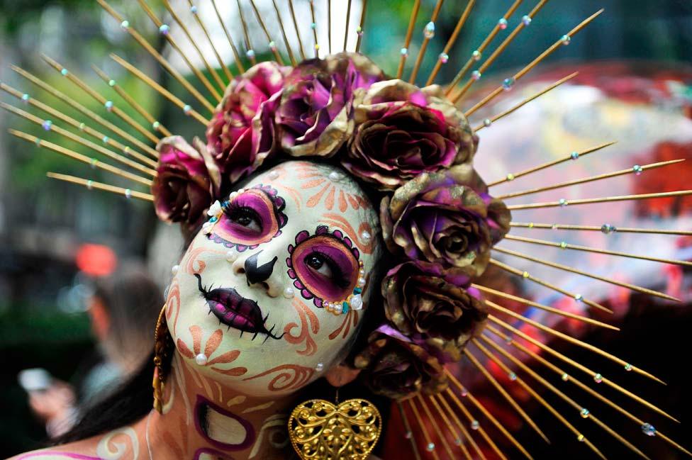 A woman fancy dressed as Catrina takes part in the "Catrinas Parade" in Mexico City