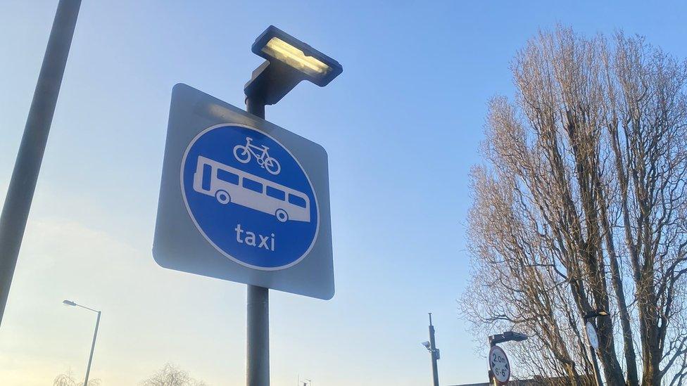 Road sign saying on buses, taxis or cyclists can enter