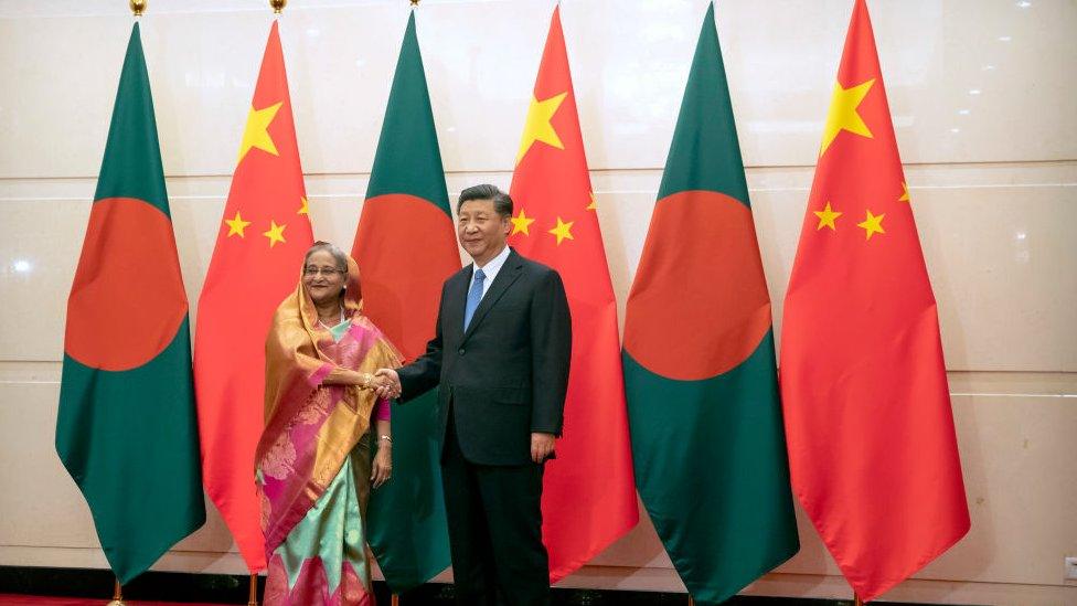 Bangladesh's Prime Minister Sheikh Hasina shakes hands with Chinese President Xi Jinping as she arrives for a meeting at the Diaoyutai State Guesthouse on 5 July 2019 in Beijing, China