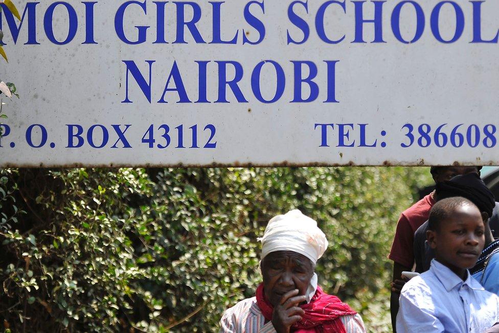 Relatives wait for news at the entrance of Moi Girls School in Nairobi, Kenya, after a fatal pre-dawn blaze gutted one of the boarding facilities at the school leading to several deaths, 2 September 2017