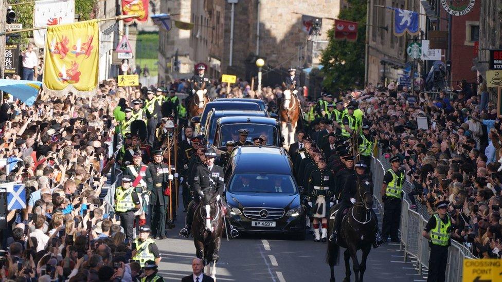 There was a solemn hush as the procession moved through crowds on the Royal Mile