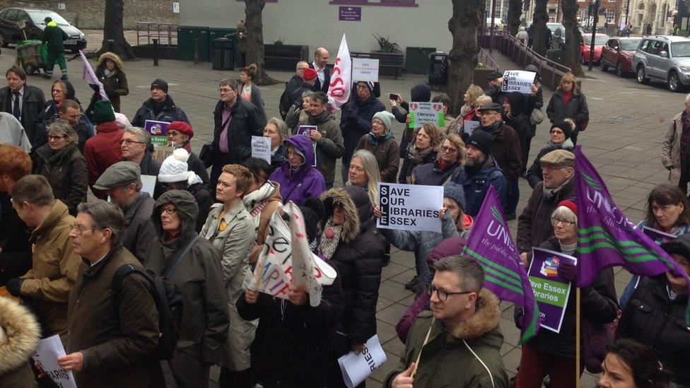 Protesters outside the library meeting