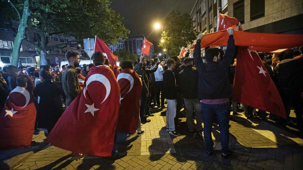 Protesters gather for a demonstration against a military coup in Turkey in front of the Turkish consulate in Rotterdam on 16 July 2016.