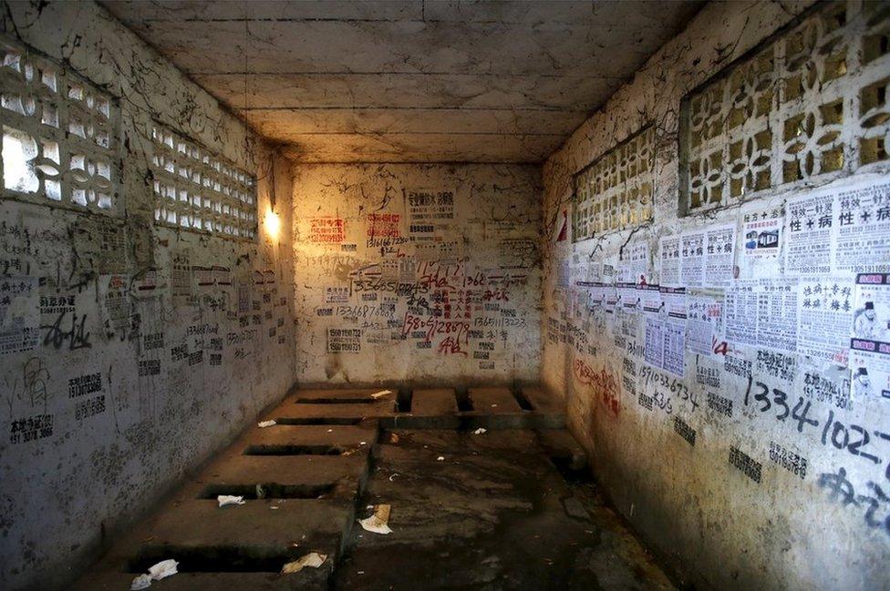 Public toilet in a residential area for migrant workers in Shigezhuang village, Beijing, China.