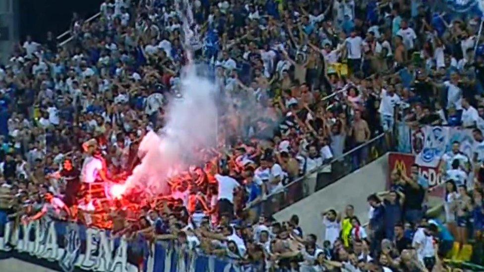 Flares let off during the match