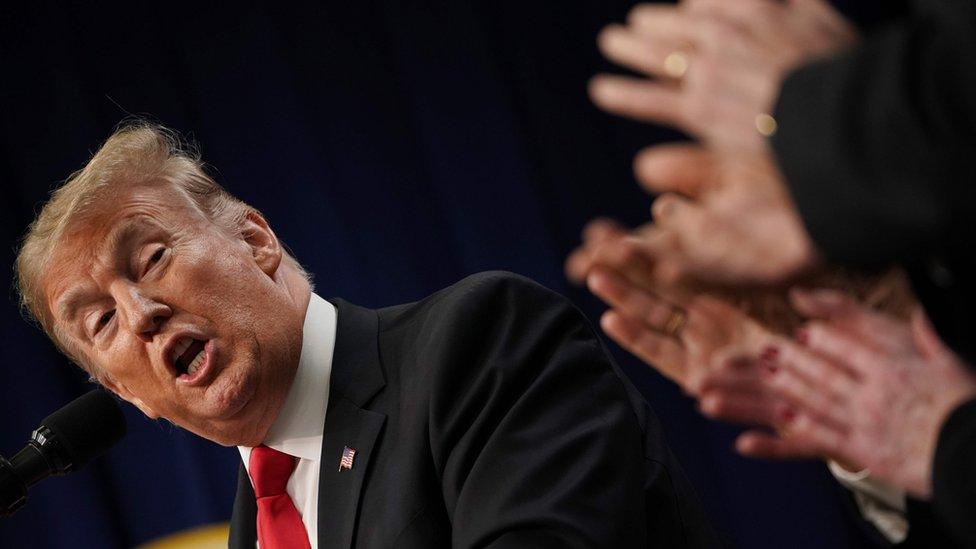 US President Donald Trump is applauded during a signing ceremony for the Agriculture Improvement Act of 2018 at the White House on December 20, 2019 in Washington, DC. (