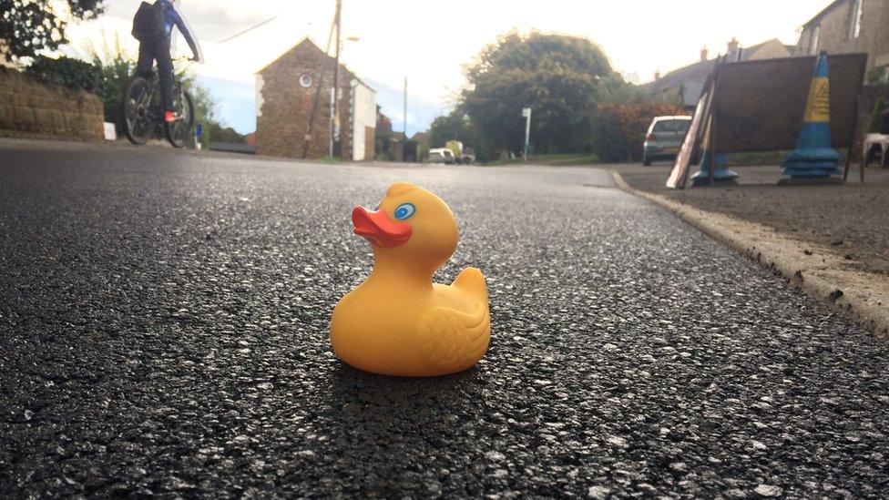 Rubber duck on resurfaced road