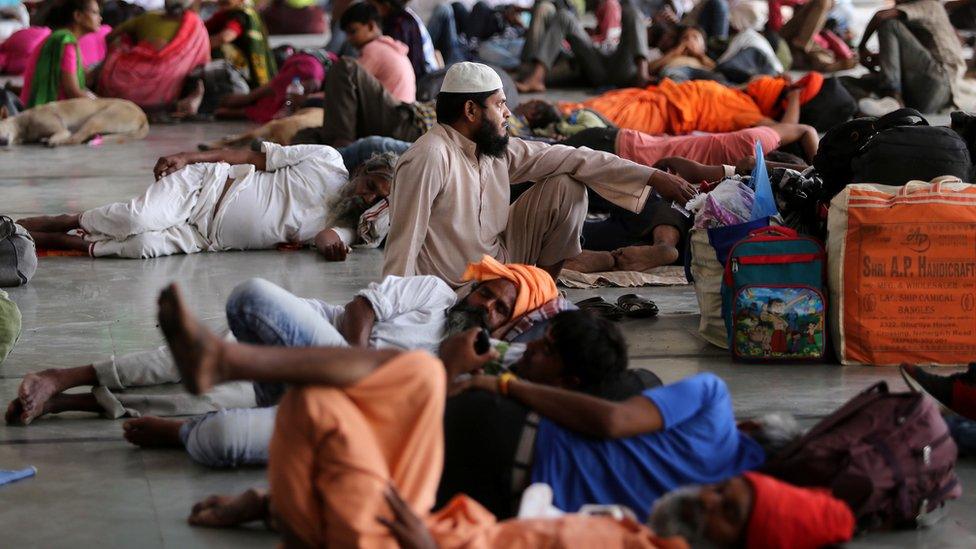 Stranded passengers wait for train services to resume at a railway station after their trains were cancelled following Cyclone Fani, in Ahmedabad, India May 3, 2019