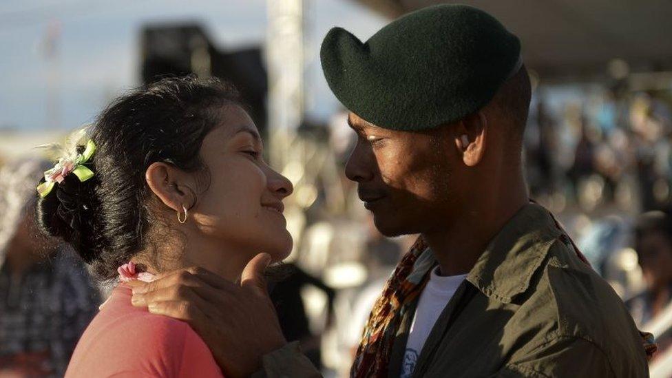 Members of the Colombian Revolutionary Armed Forces of Colombia (Farc) guerrilla attend the broadcasting of the signing of the peace at El Diamante rebel camp, Caqueta department,