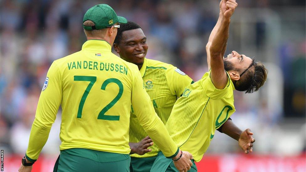 Rassie van der Dussen, Lungi Ngidi (centre) and Imran Tahir celebrate a wicket for South Africa