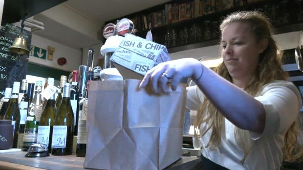 Helen Greer packing a takeaway bag