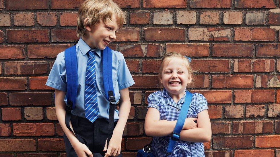 Boy and girl in school uniform