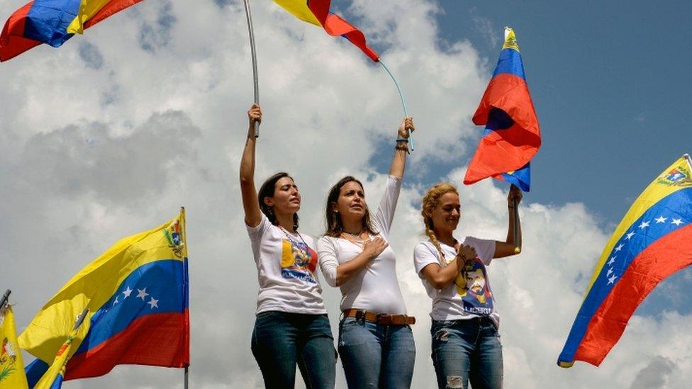 Patricia de Ceballos (L), wife of the imprisoned former mayor, Daniel Ceballos, Venezuelan opposition ex-congresswoman Maria Corina Machado (C) and Lilian Tintori , wife of jailed opposition leader Leopoldo Lopez