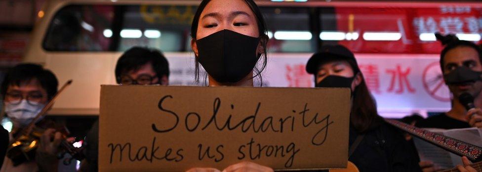 A protester holds up a sign saying "Solidarity makes us strong" during the protests- October 23rd 2019.