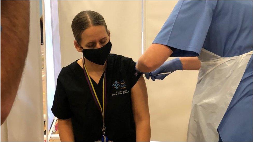 Dr Ami Jones receives her jab