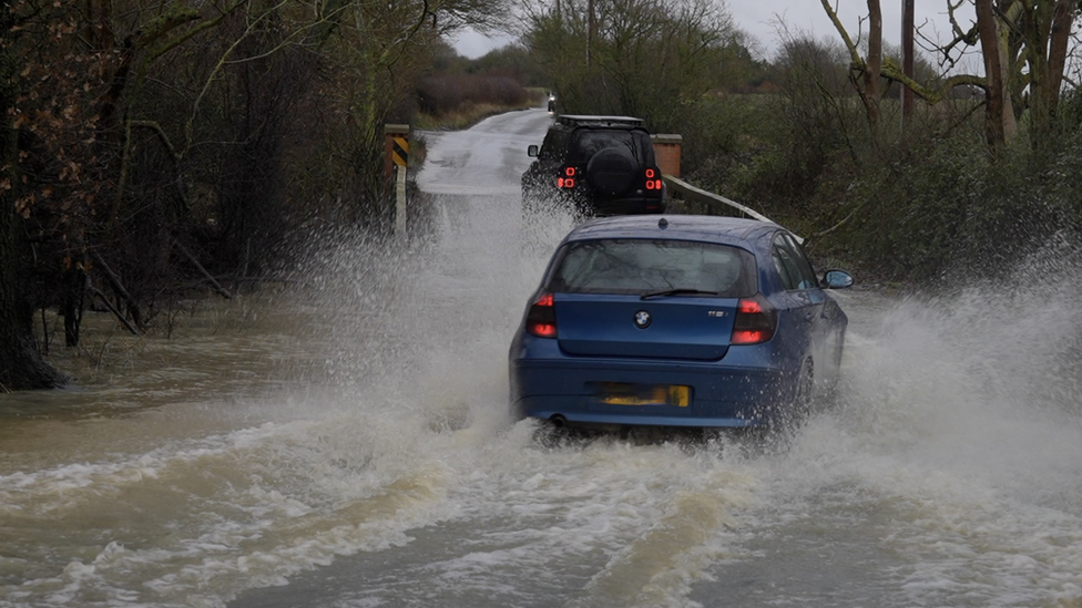 Cars being pulled out of a Ford