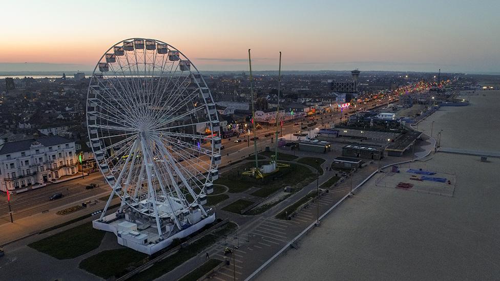 Aerial view of Great Yarmouth big wheel and Golden Mile at dusk