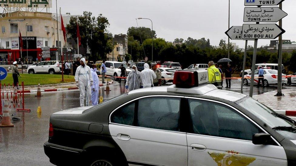 Tunisian forensic police investigate the site of an attack on Tunisian National Guard officers on September 6, 2020, in Sousse