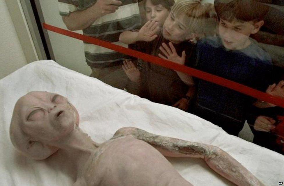 An alien model on display inside the International UFO Museum and Research Center in Roswell