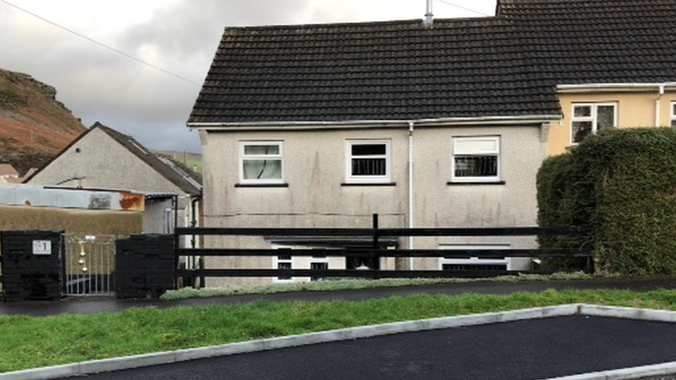 A photo of the family's semi-detached home