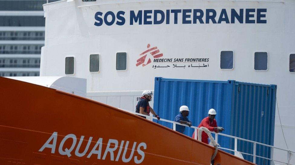 Workers on board Aquarius in dock