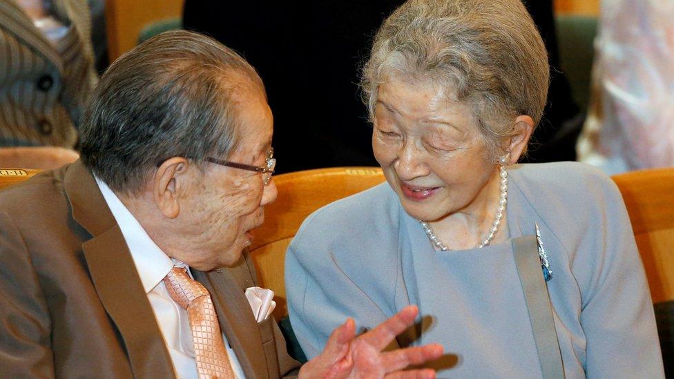 Japanese Empress Michiko (R) talks with physician Shigeaki Hinohara prior to a concert performed by South Korean tenor Bae Jae-chul in Tokyo, Japan, July 31, 2016