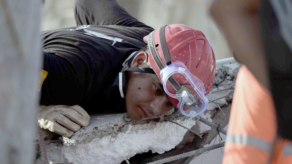 Rescuers search for victims buried under the rubble in Pedernales, Ecuador on April 19, 2016