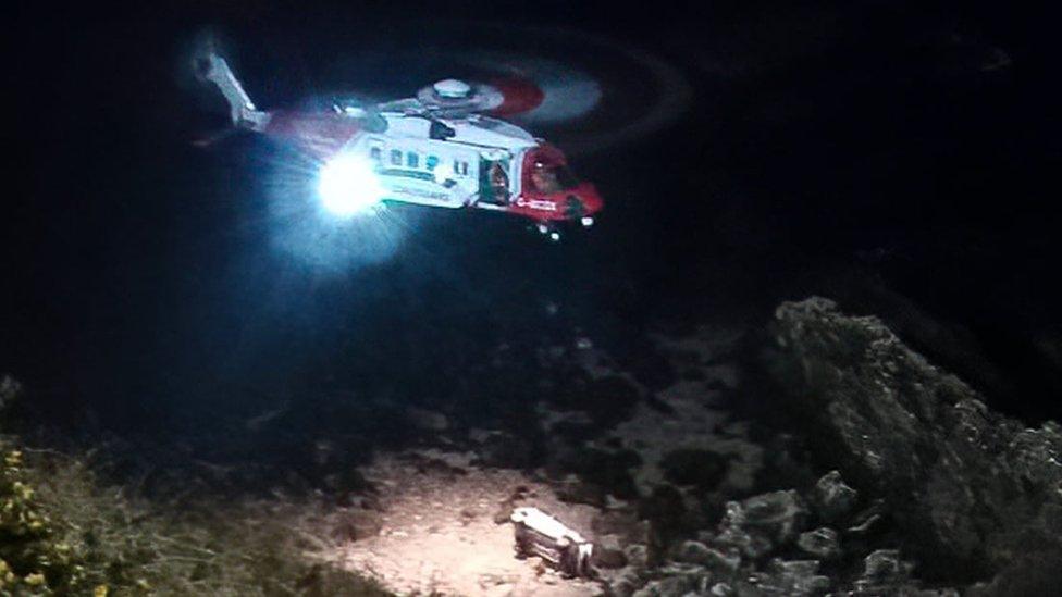 Coastguard helicopter over crash scene