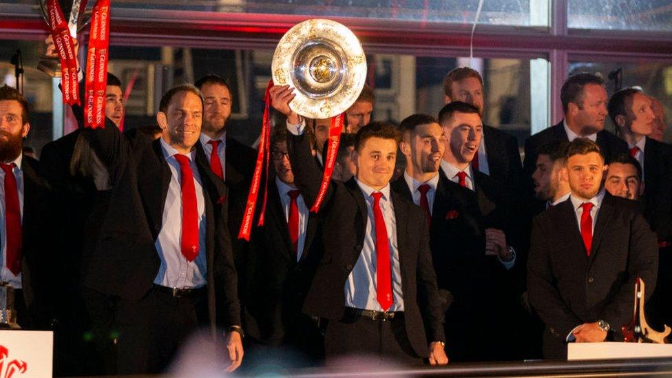 Jonathan Davies holding Triple Crown trophy