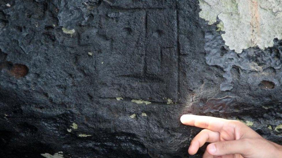 View of ancient stone carvings on a rocky point of the Amazon river that were exposed after water levels dropped to record lows during a drought in Manaus, Amazonas state, Brazil October 23, 2023.