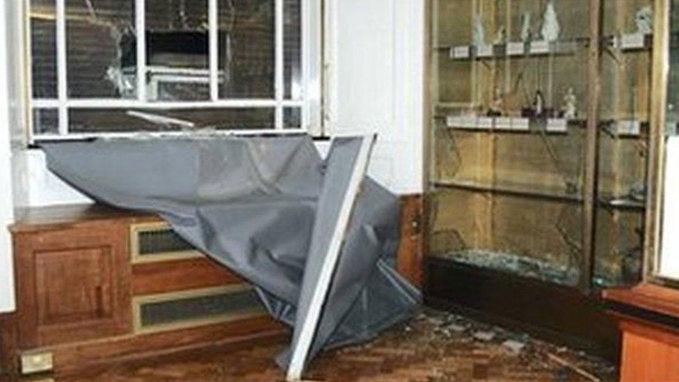 Smashed cabinets and a smashed window following the theft at the museum