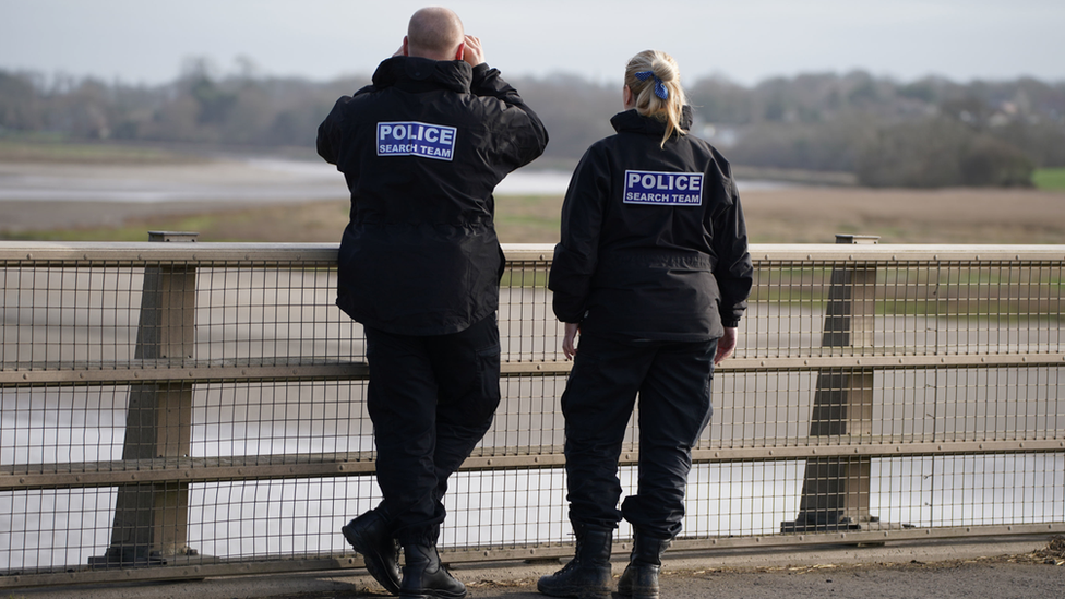 Police officers on the Shard Bridge on the River Wyre