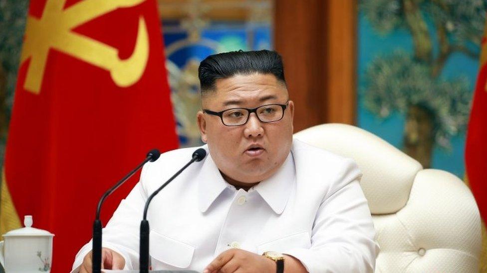 A North Korean state media photo from the weekend of Kim Jong-un at the emergency meeting held to discuss the "Covid-19" patient