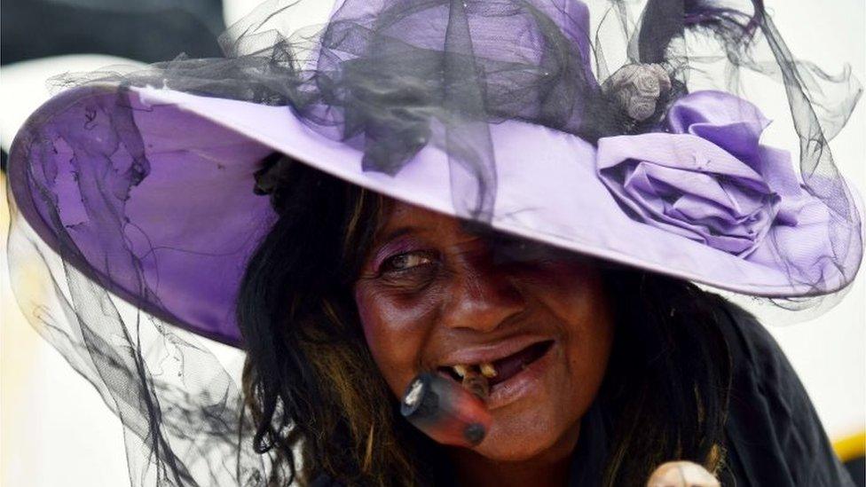 Voodoo followers take part in ceremonies honouring the Haitian voodoo spirits of Baron Samdi and Gede during Day of the Dead in a cementery in Port-au-Prince on 1 November, 2015.