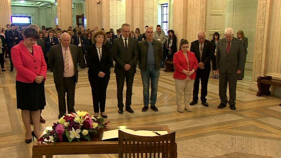 Stormont politicians stand for a minute's silence