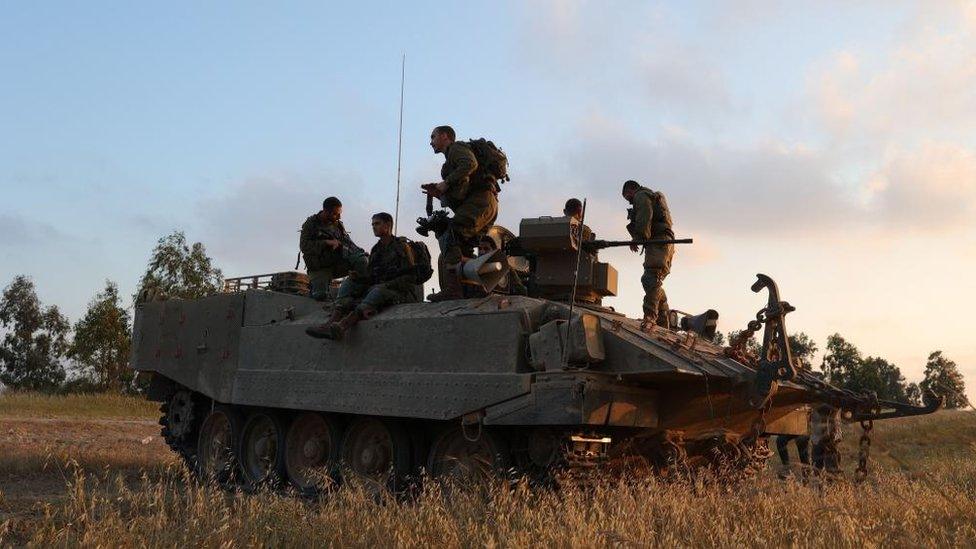 Israeli soldiers on a tank