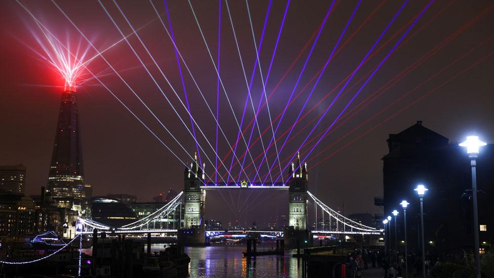 Fireworks and drones illuminate the night sky over the The O2 in London as they form a light display as London"s normal New Year"s Eve fireworks display was cancelled due to the coronavirus pandemic.